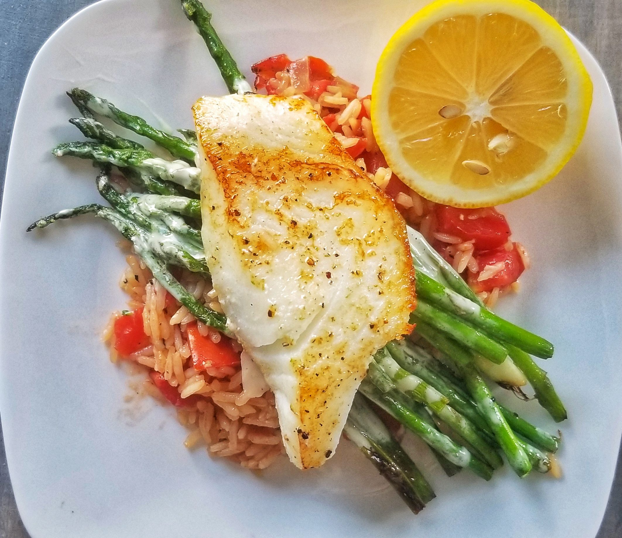 Sea Bass With Tomato Risotto Asparagus And Creamy Lemon Sauce The Perfectly Imperfect Life